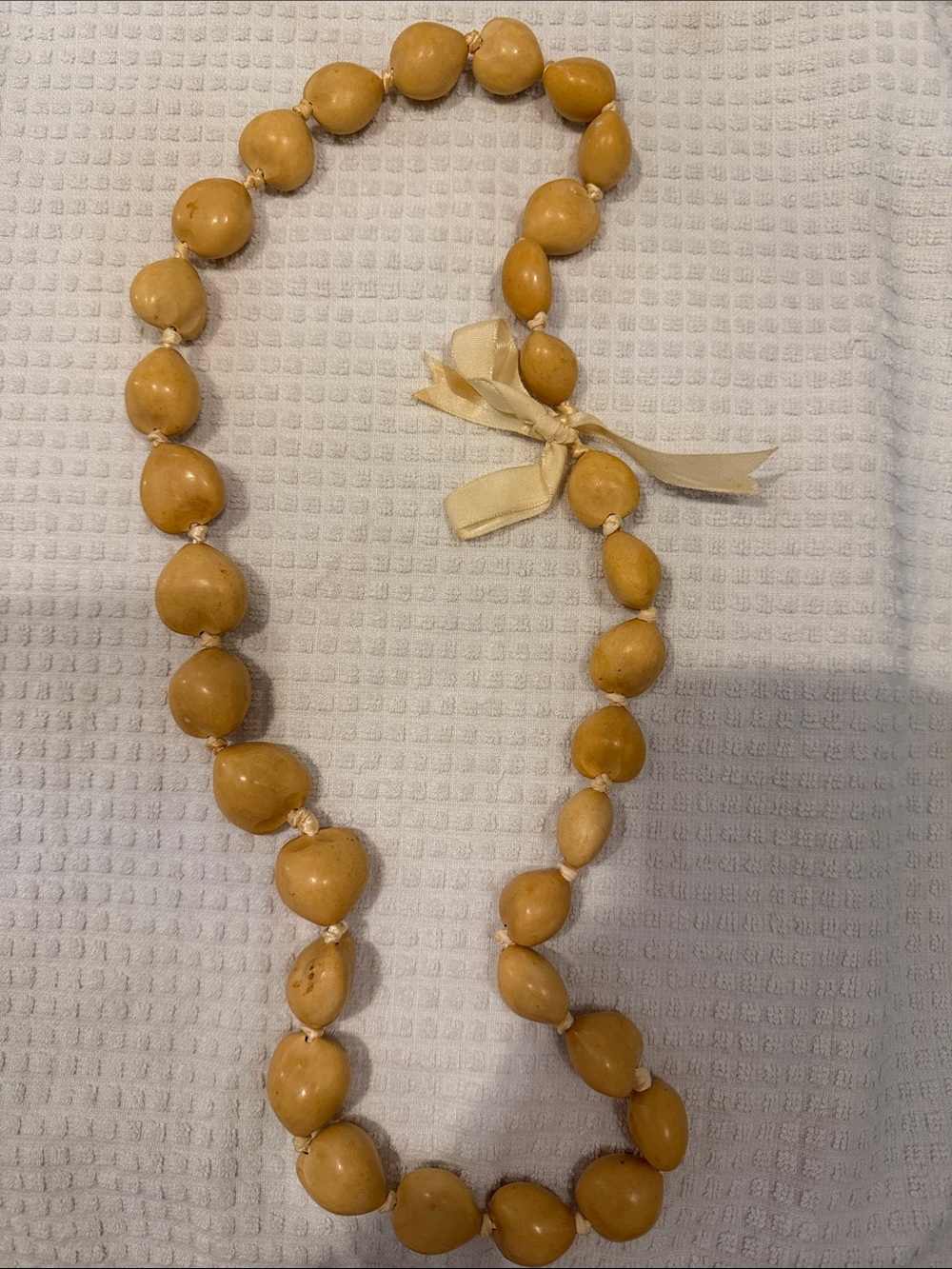 Handcrafted Cream kukui nut Bead lei with Satin Ribbon